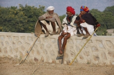 old men sitting and talking