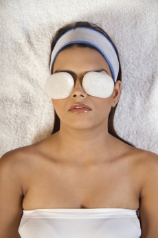 woman taking stone massage at spa