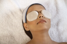 woman taking stone massage