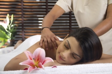 woman taking massage at spa centre