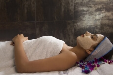 woman with facepack at massage parlour 