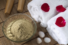 spa settings with towels and sandalwood