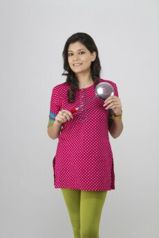 girl posing with spatula 