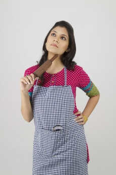 portrait of a woman holding a rolling pin