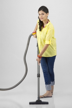 woman cleaning with vacuum cleaner 