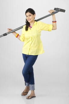 woman posing with vacuum cleaner 
