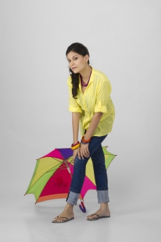 young girl posing with umbrella 