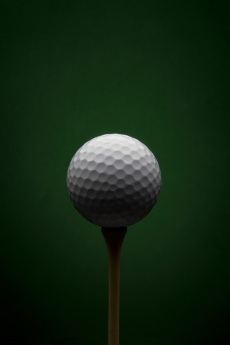 Golf ball with dark green background