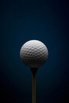 Golf ball with blue background