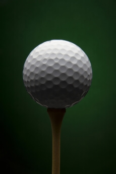 Golf ball with green background