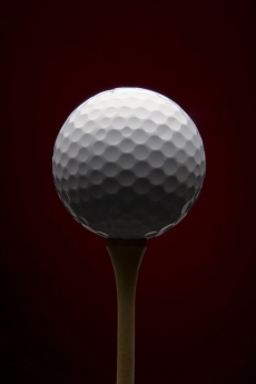 Golf ball with red background