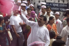 people playing with colours during ganesh visarjan festival 