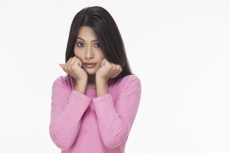 sad girl posing with hands on face