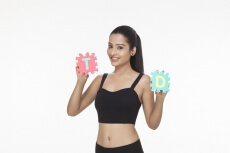 girl posing with letter T and D