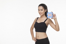 girl posing with alphabet H