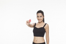 girl posing with letter S