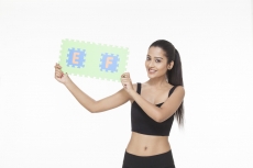 girl posing with jigsaw puzzle 
