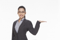 girl showing with hand while posing for the camera