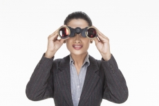 woman crying while looking through binocular