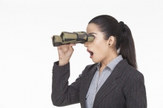 woman in shocking expression while looking through binocular 