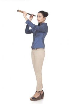 young business woman looking through telescope 