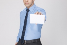 man displaying white placard 
