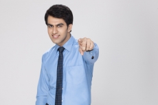 young executive pointing at something 