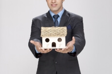 man holding home miniature
