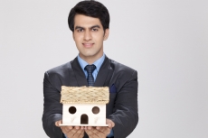 man posing with home miniature