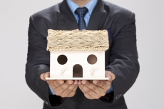 man showing home miniature