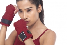 girl wearing gloves posing in self defense 