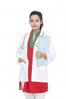 lady doctors standing in uniform with cardboard in hand