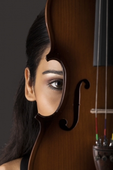 close-up on the eye of a girl with violin
