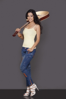 girl posing with guitar