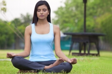 girl posing in mudra position