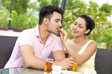 lady feeding food to her man