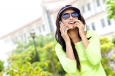 girl in park talking on phone 