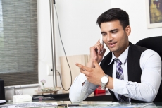 man at his office desk