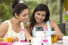 girls on breakfast table