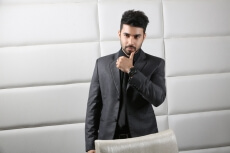man in professional wear posing at work