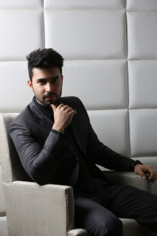 man in formal wear posing with attitude