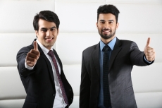 man posing happily and doing thumbs up