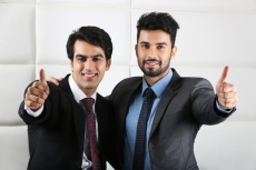 two men doing thumbs up