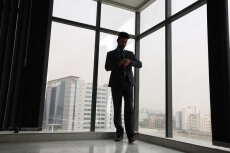 man in formals checking time
