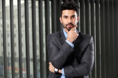 man posing wearing formal attire
