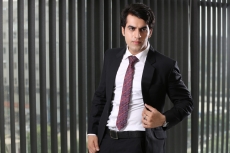 man posing in formal attire
