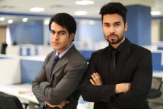 professional men with hands folded