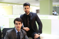 men in formal wear sitting and posing  
