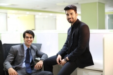 men in formal wear sitting and posing  