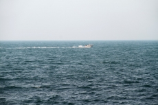 beautiful sea with boat in the middle of the sea 
